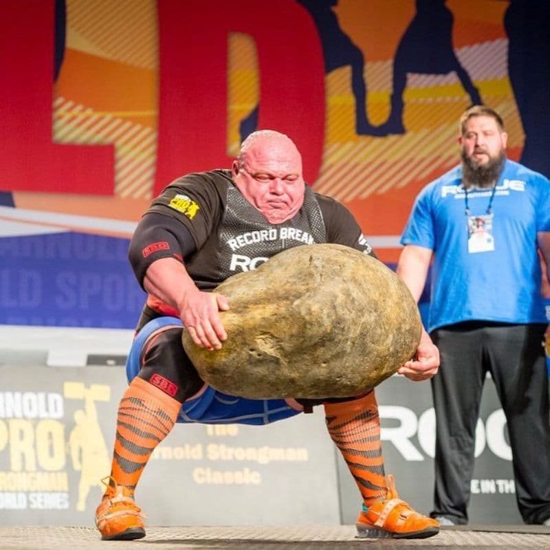 Man Lifting Giant Stone meme template